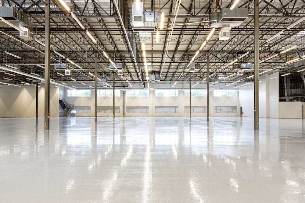 Polished epoxy garage floor with reflective glossy finish